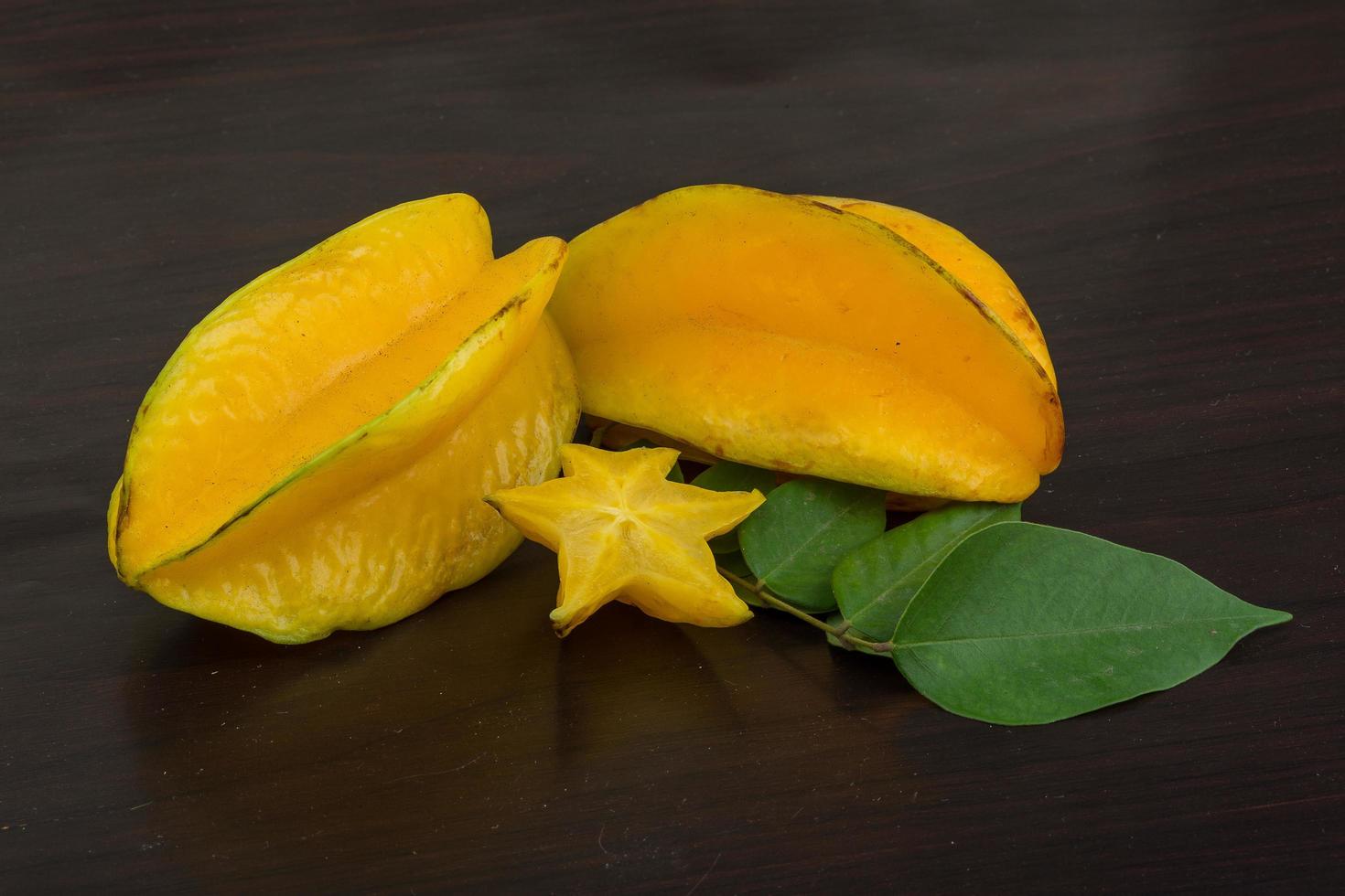 Carambola on wooden background photo