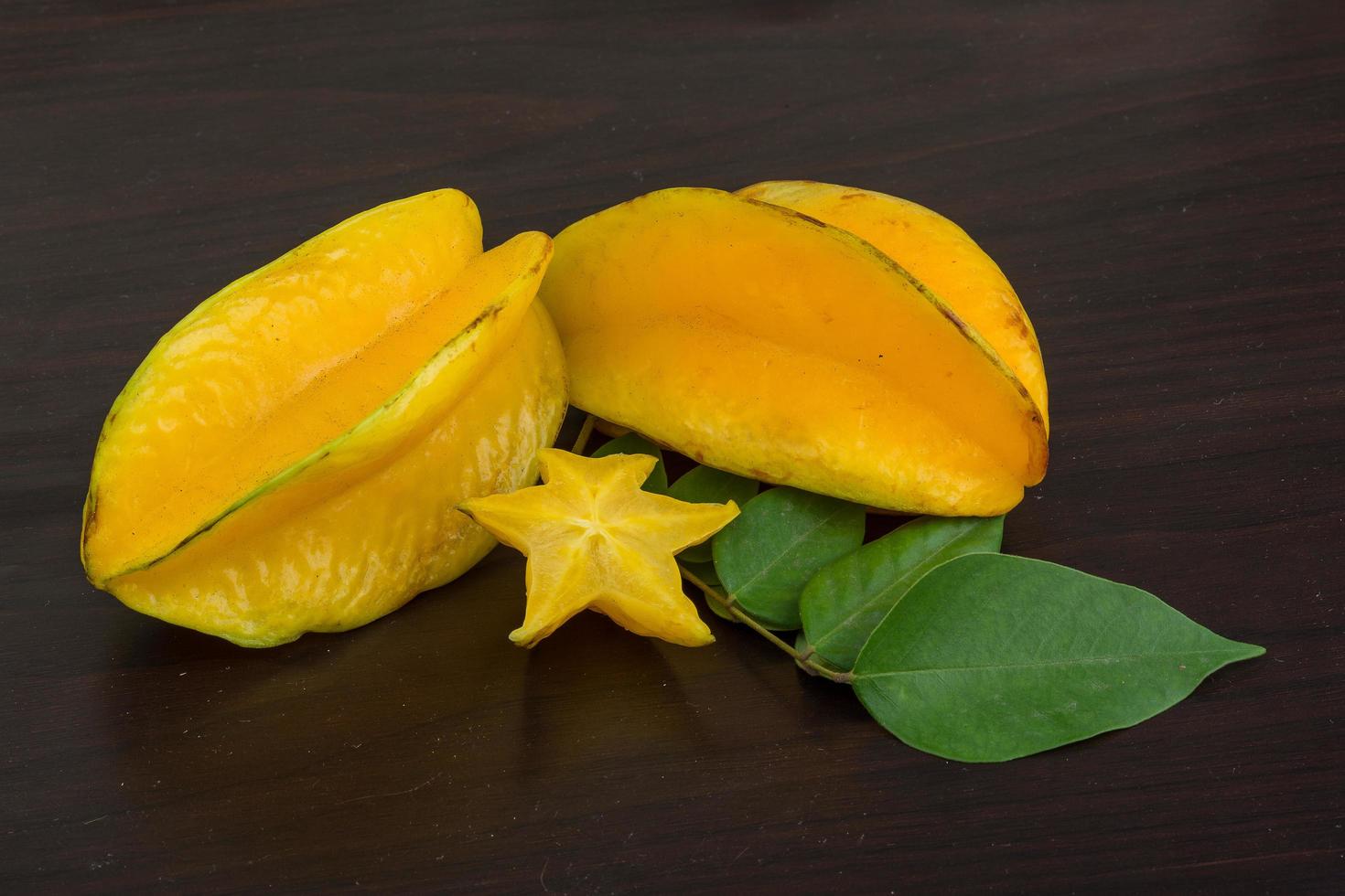 Carambola on wooden background photo