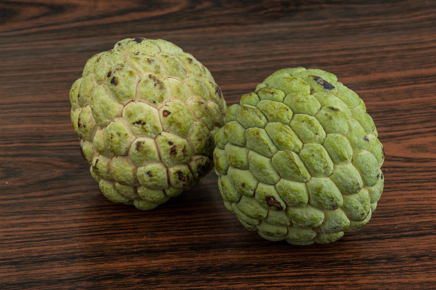 Custard apple on wooden background photo