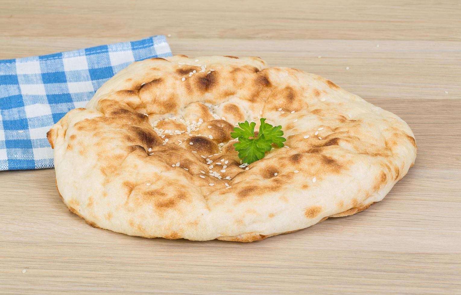 Armenian bread on wooden background photo