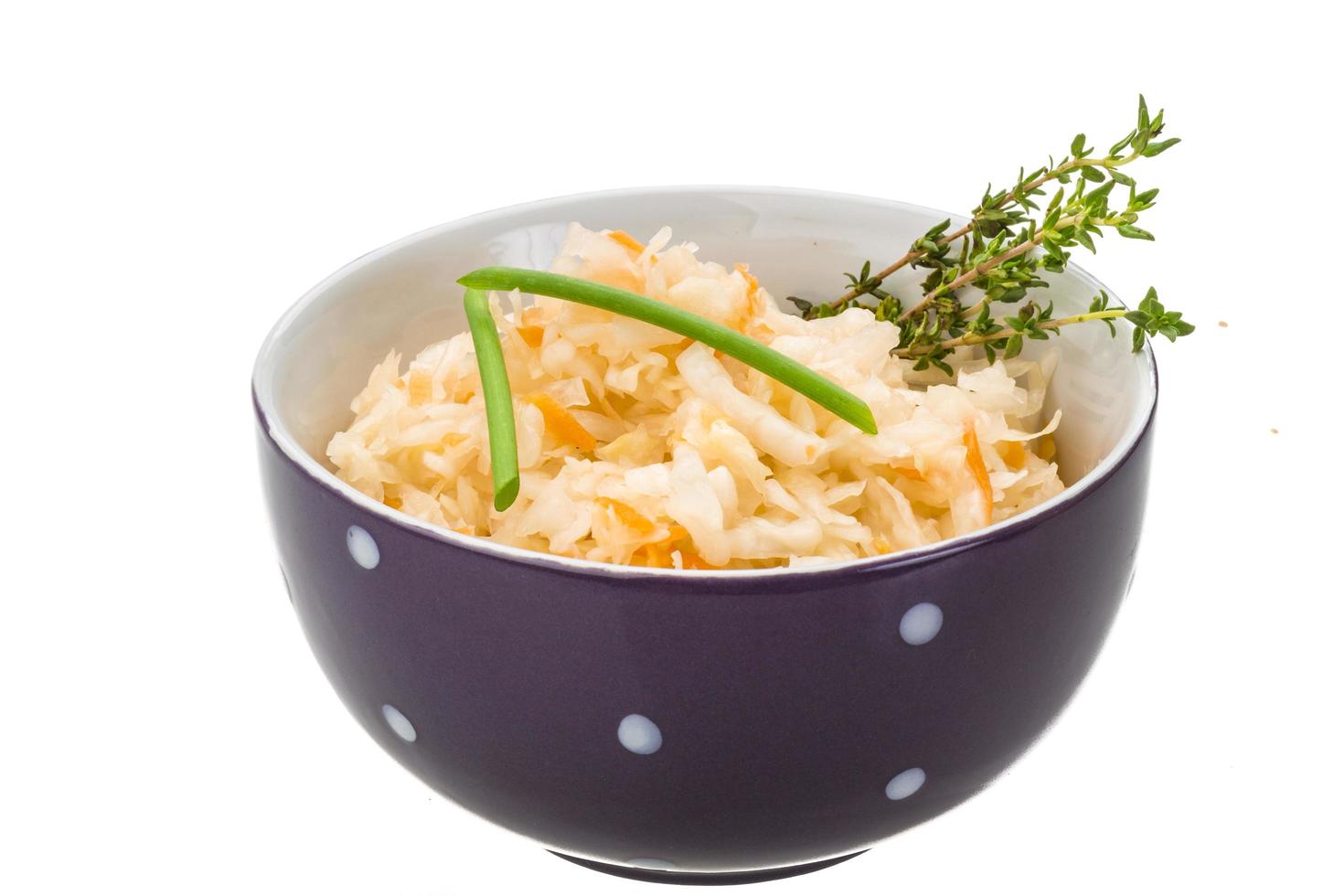 Fermented Cabbage in a bowl on white background photo