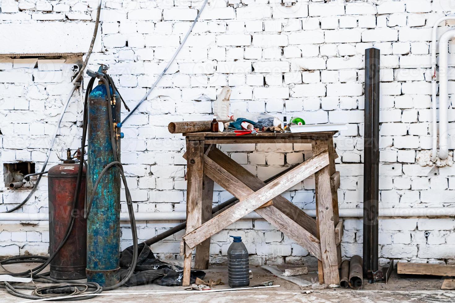 Old gas cylinders for welding and cutting. Rusty propane and oxygen tanks. photo