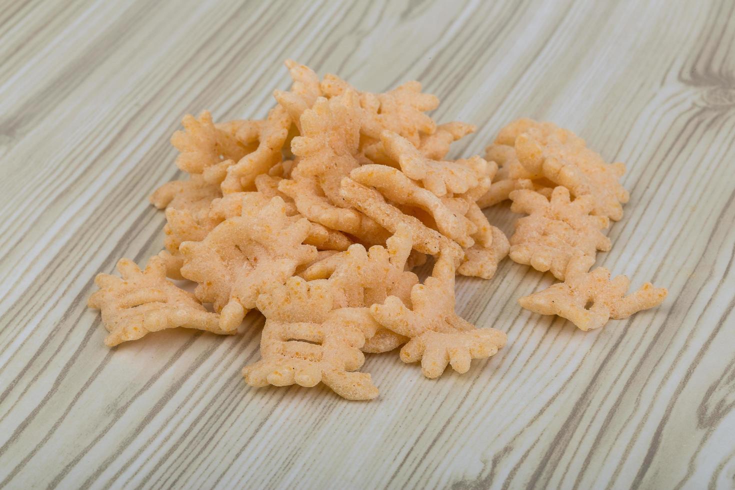 Chips on wooden background photo