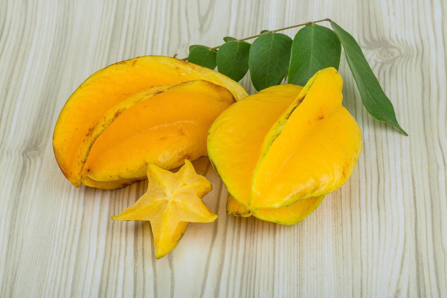 Carambola on wooden background photo