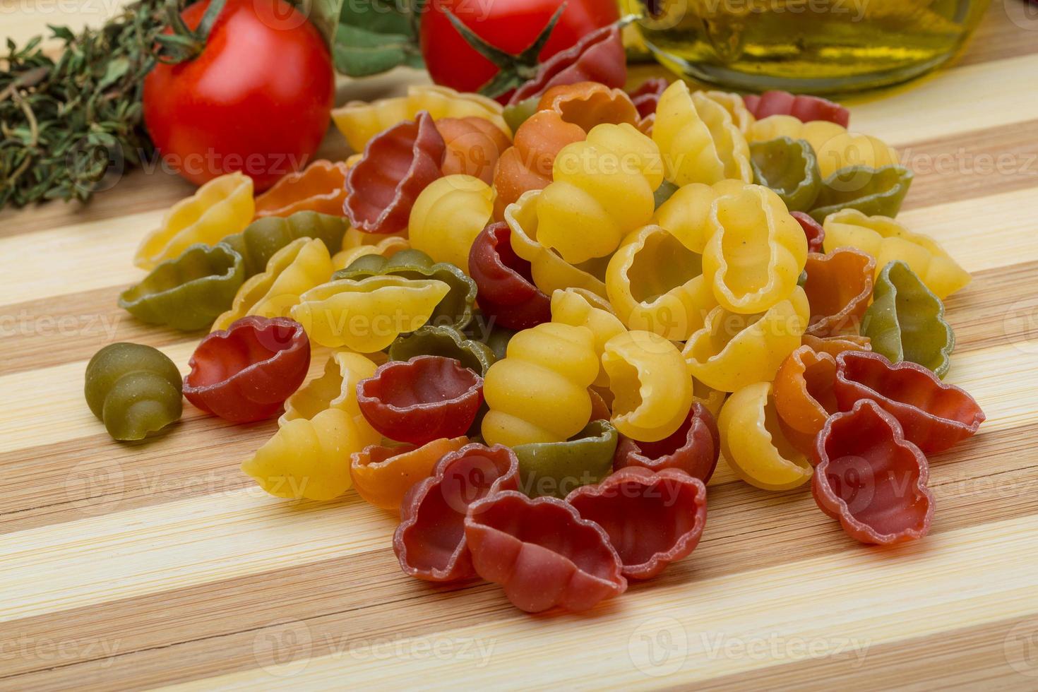 Pasta Gnocchi on wooden background photo