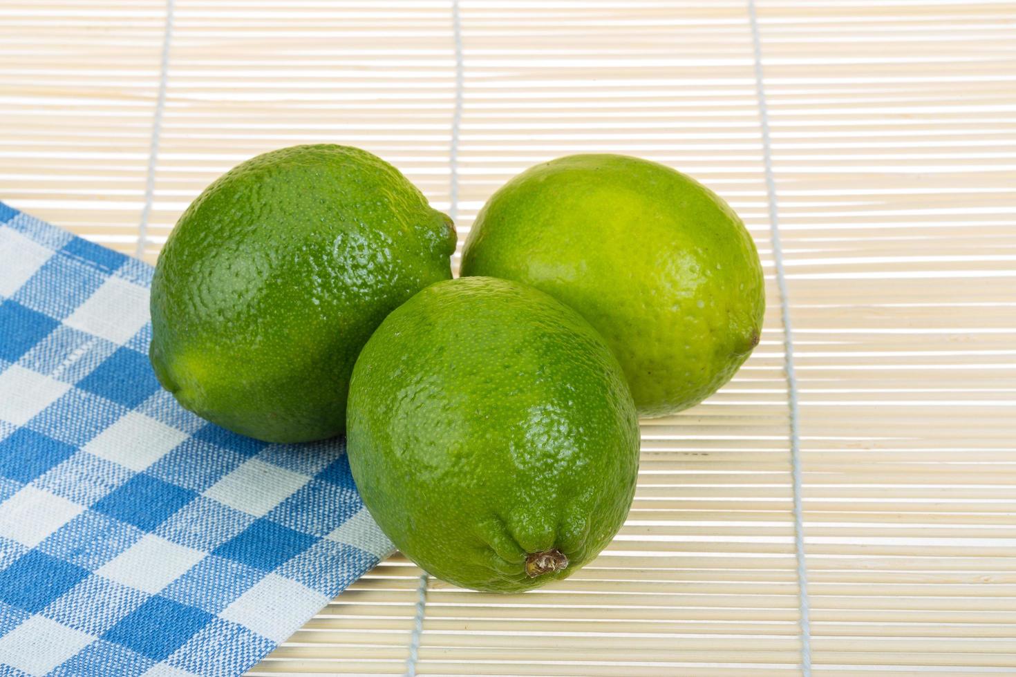 Lime on wooden background photo
