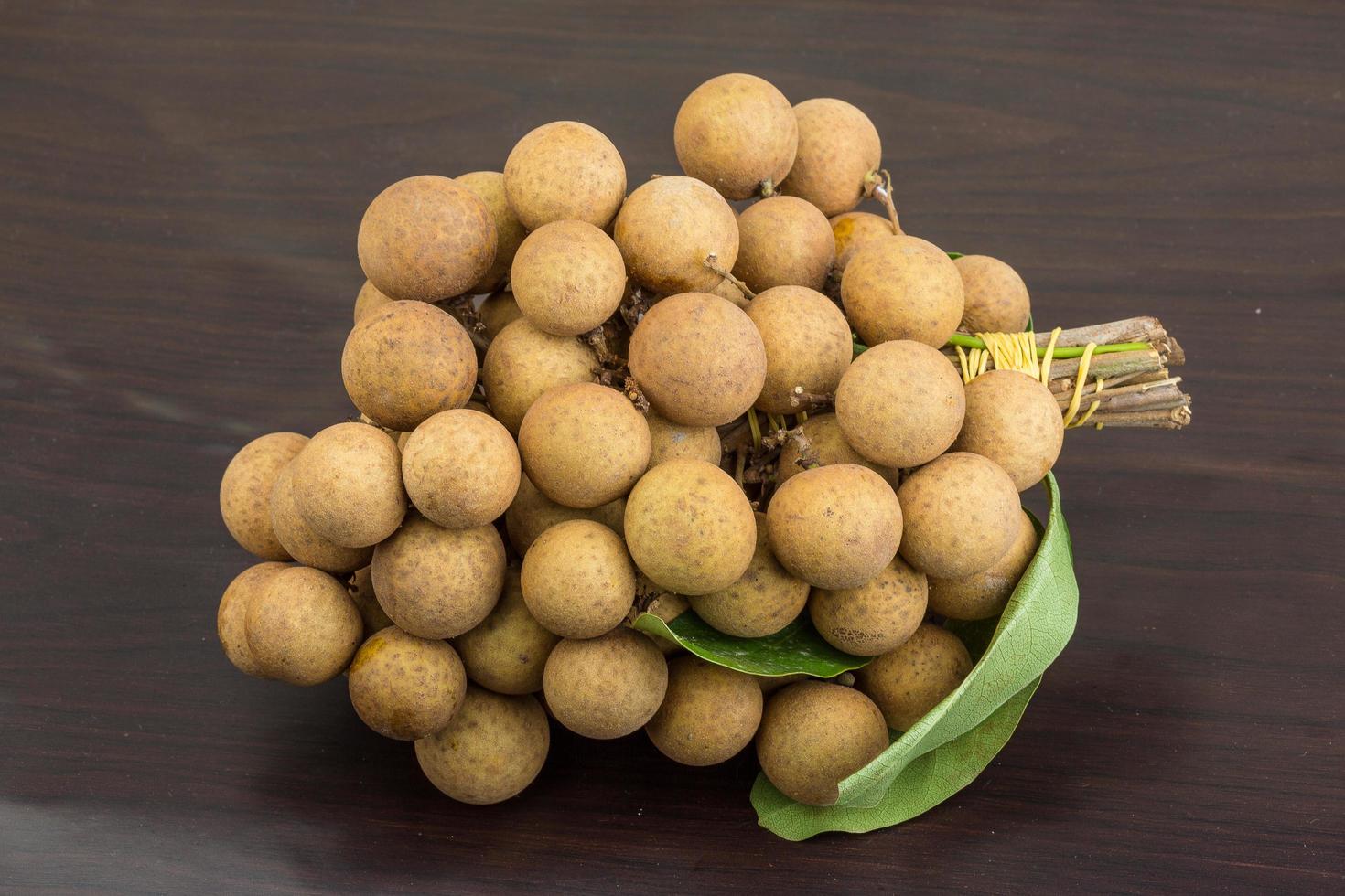 Longan on wooden background photo