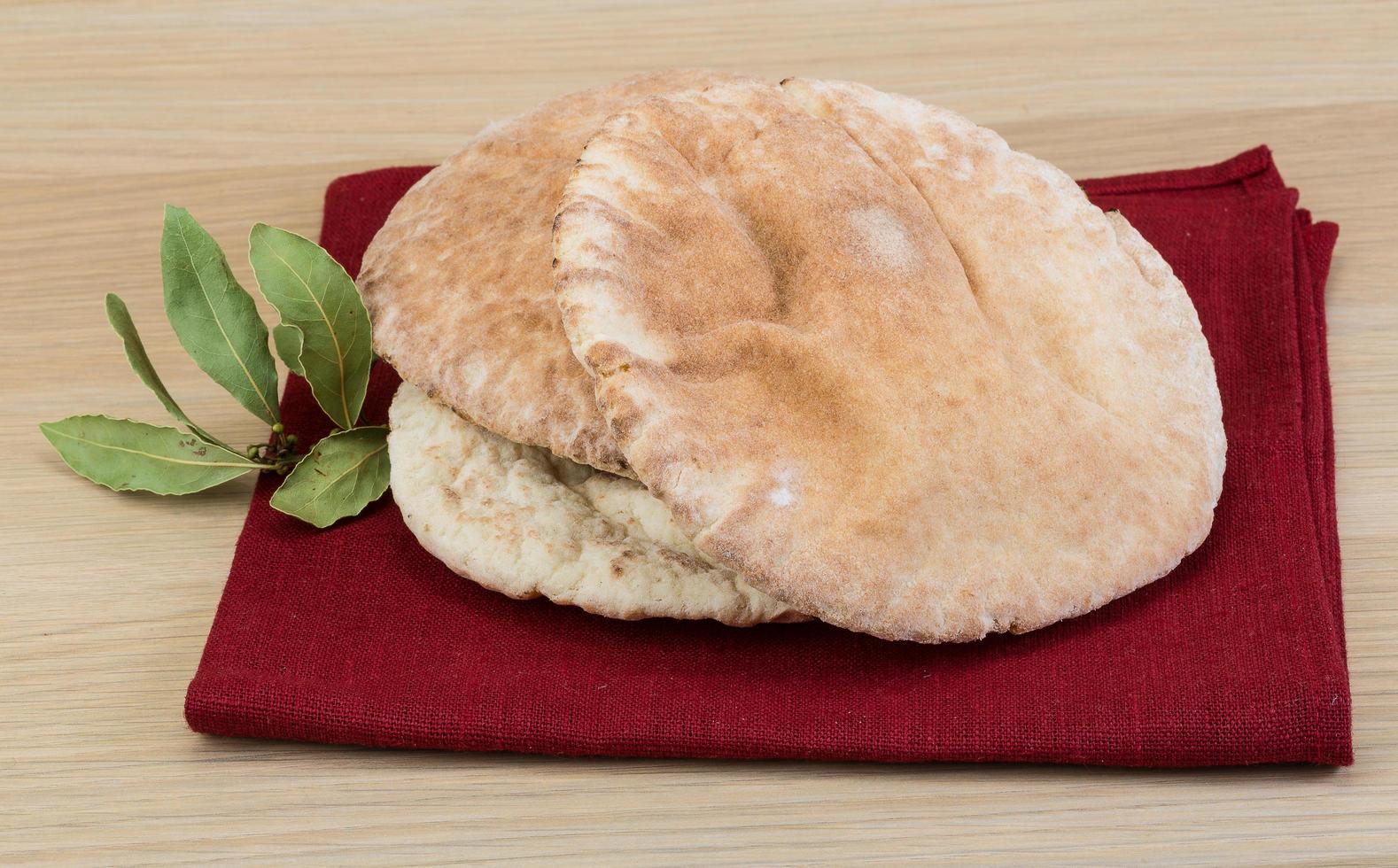 Pita on wooden background photo