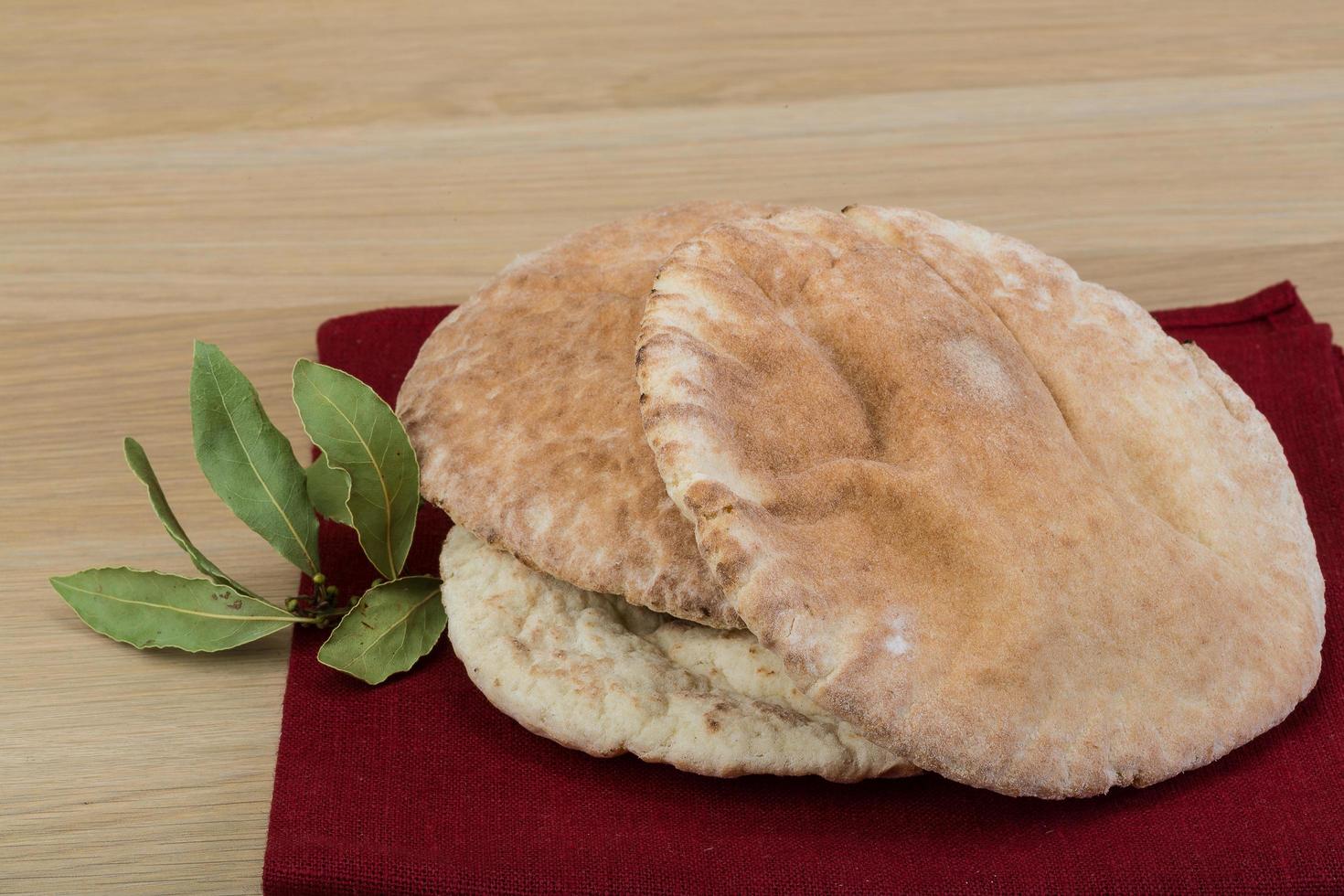 Pita on wooden background photo