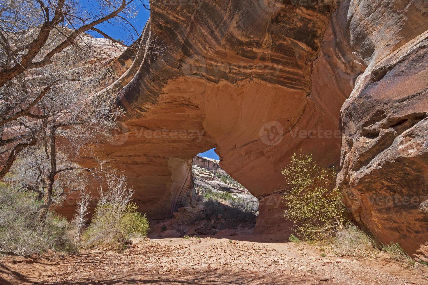 Looking Through a Natural Bridge in the Desert photo