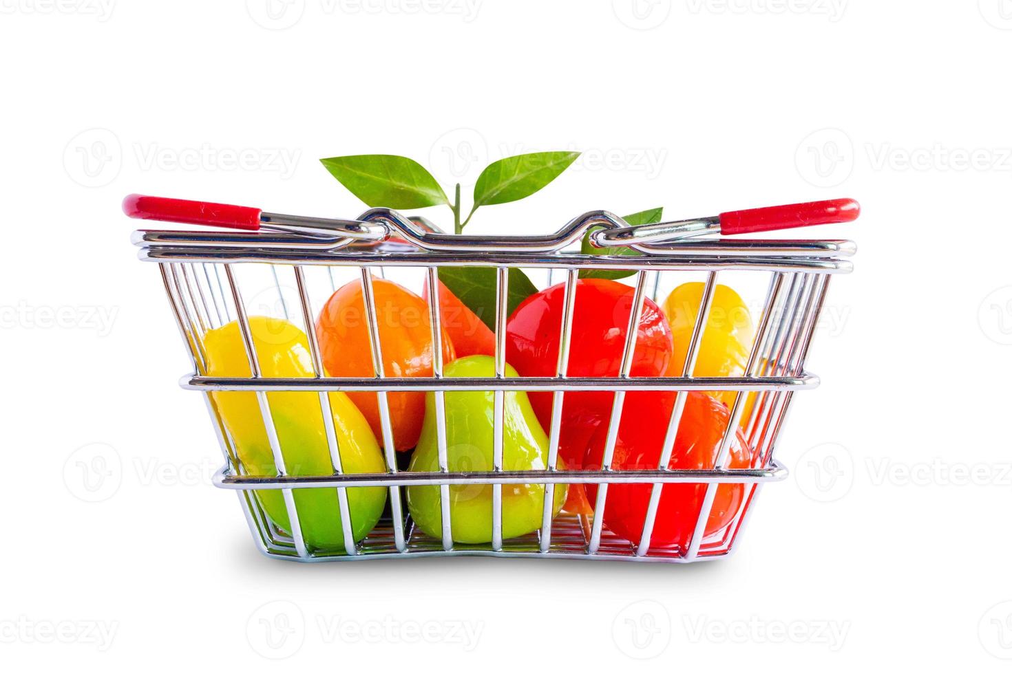 shopping basket with fruits isolated on white background photo