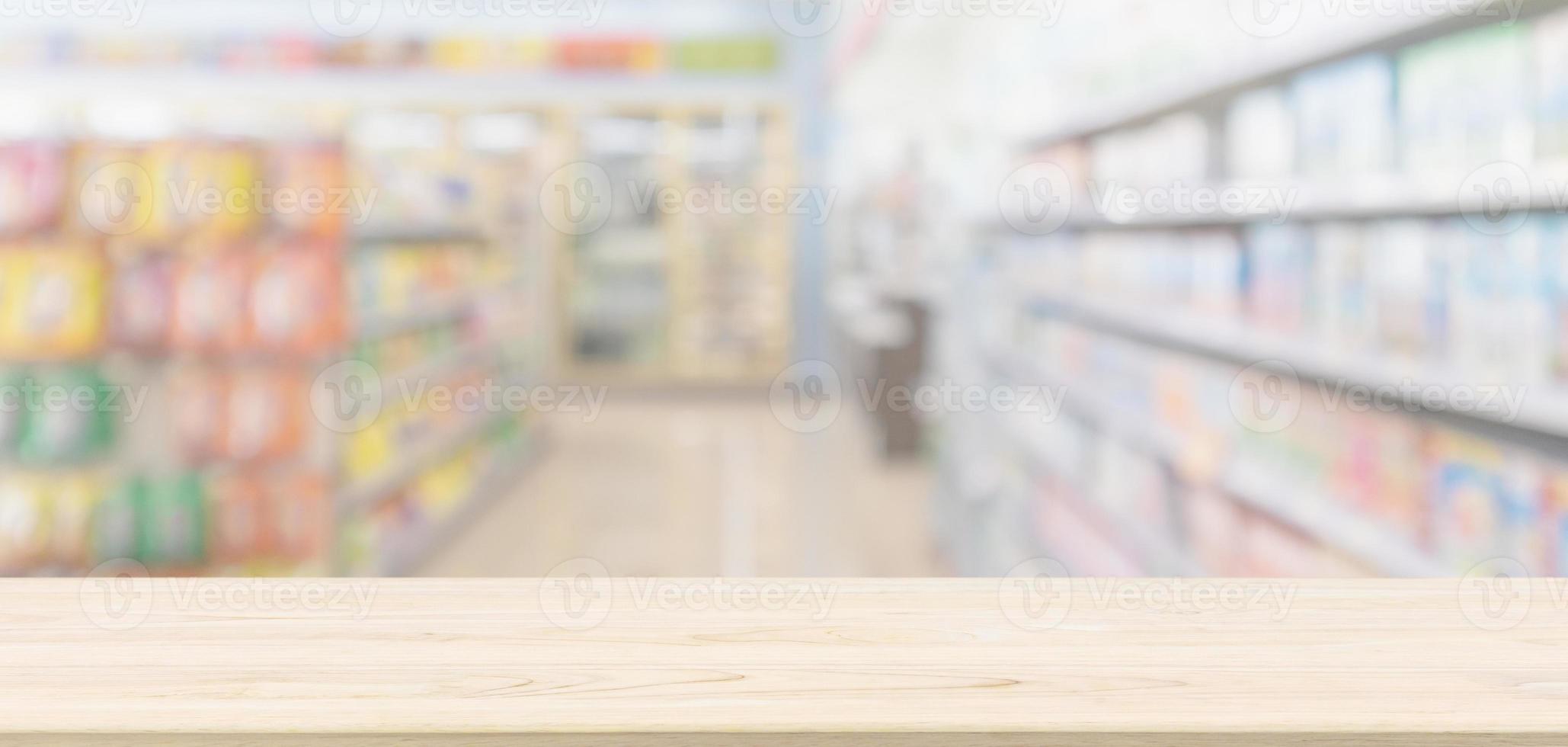 Empty Wood table top with supermarket grocery store blurred defocused background with bokeh light for montage product display photo