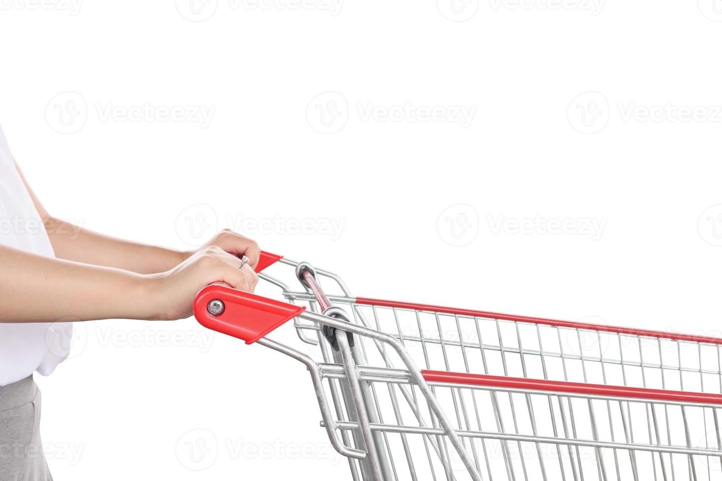 Woman push shopping cart isolated on white background photo