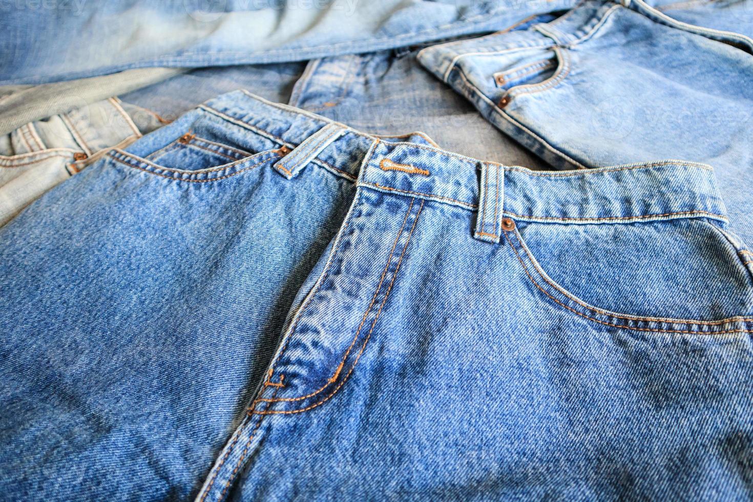 many denim blue jeans background photo