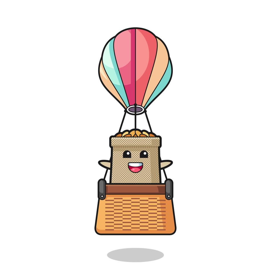 mascota del saco de trigo montando un globo aerostático vector