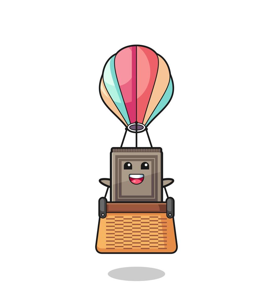 mascota de la alfombra montando un globo aerostático vector