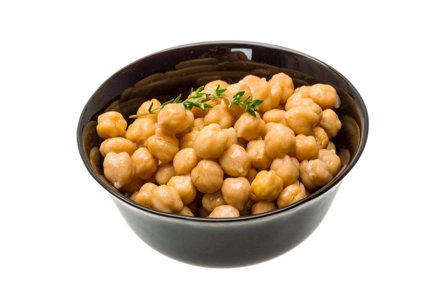 Chickpea in a bowl on white background photo