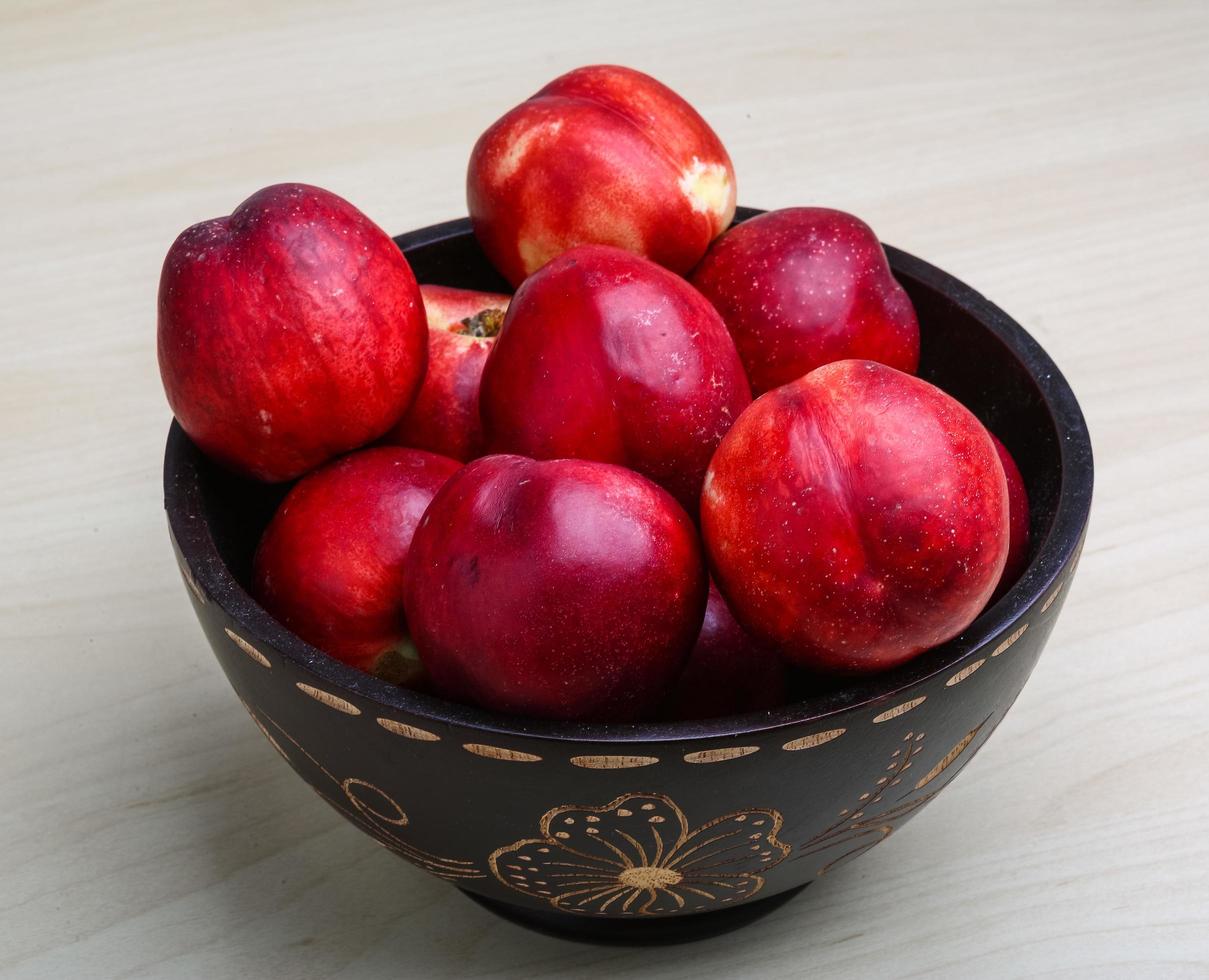 Nectarines in a bowl on white background 12072896 Stock Photo at Vecteezy