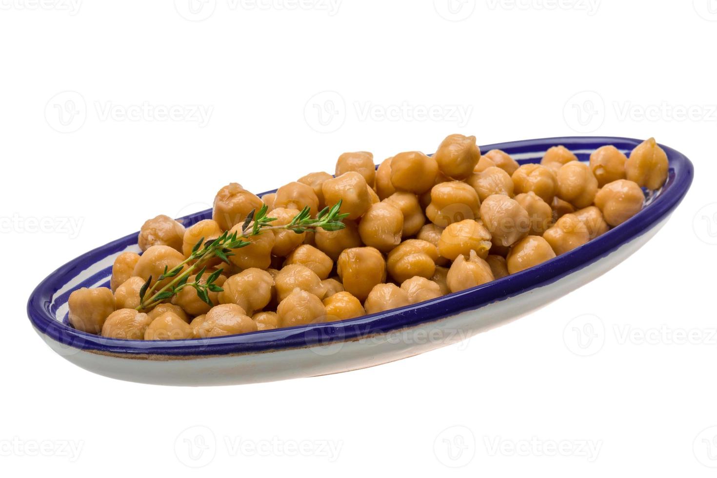 Chickpea in a bowl on white background photo