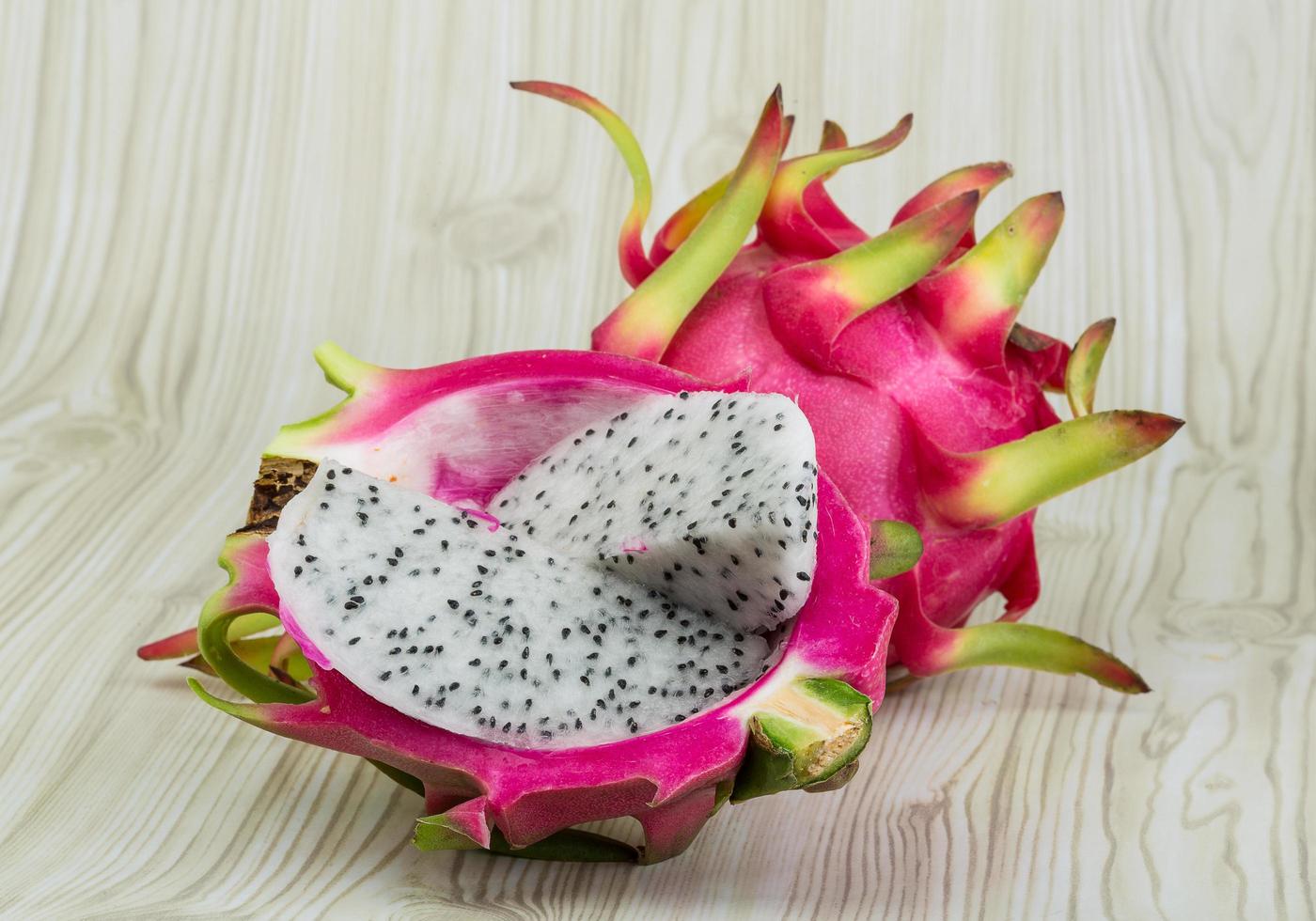 Fragon fruit on wooden background photo