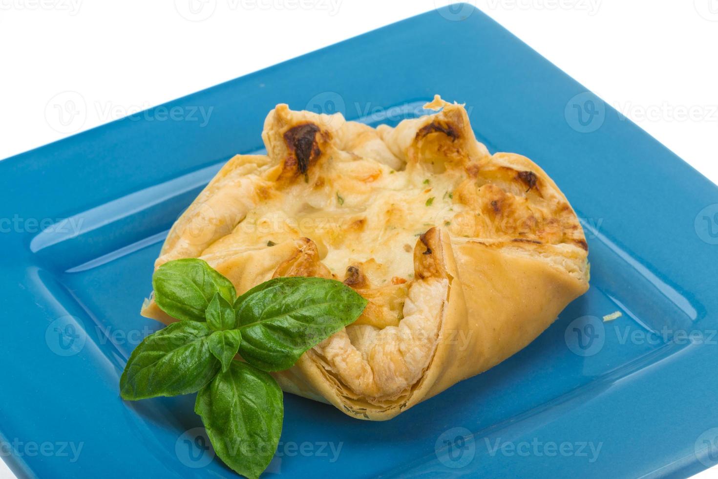 Pastry with scallop on white background photo