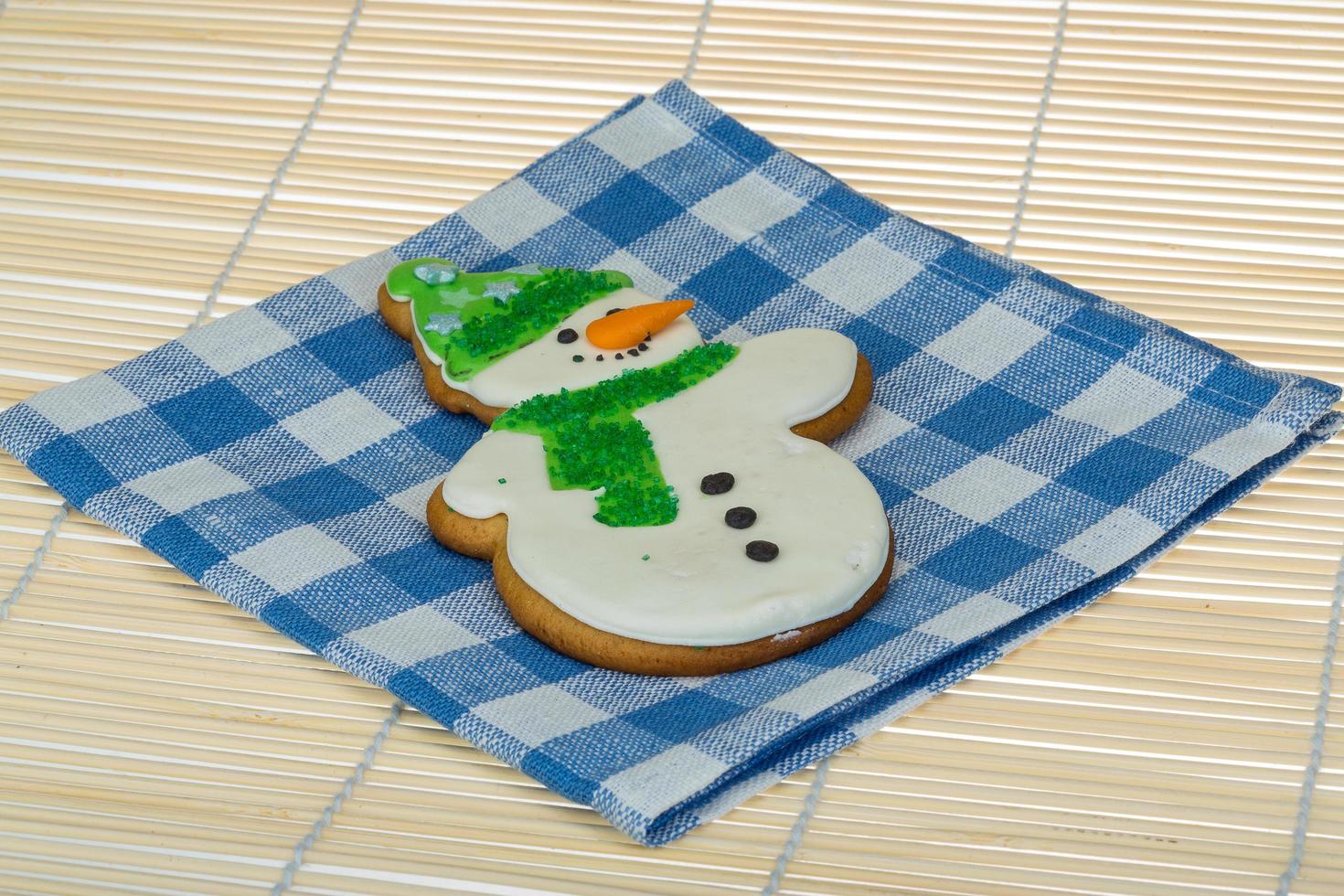 Christmas gingerbread on wooden background photo