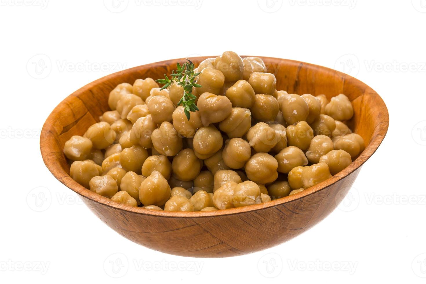 Chickpea in a bowl on white background photo