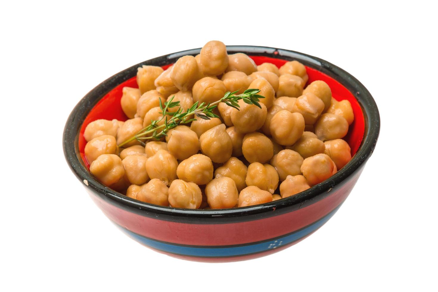 Chickpea in a bowl on white background photo