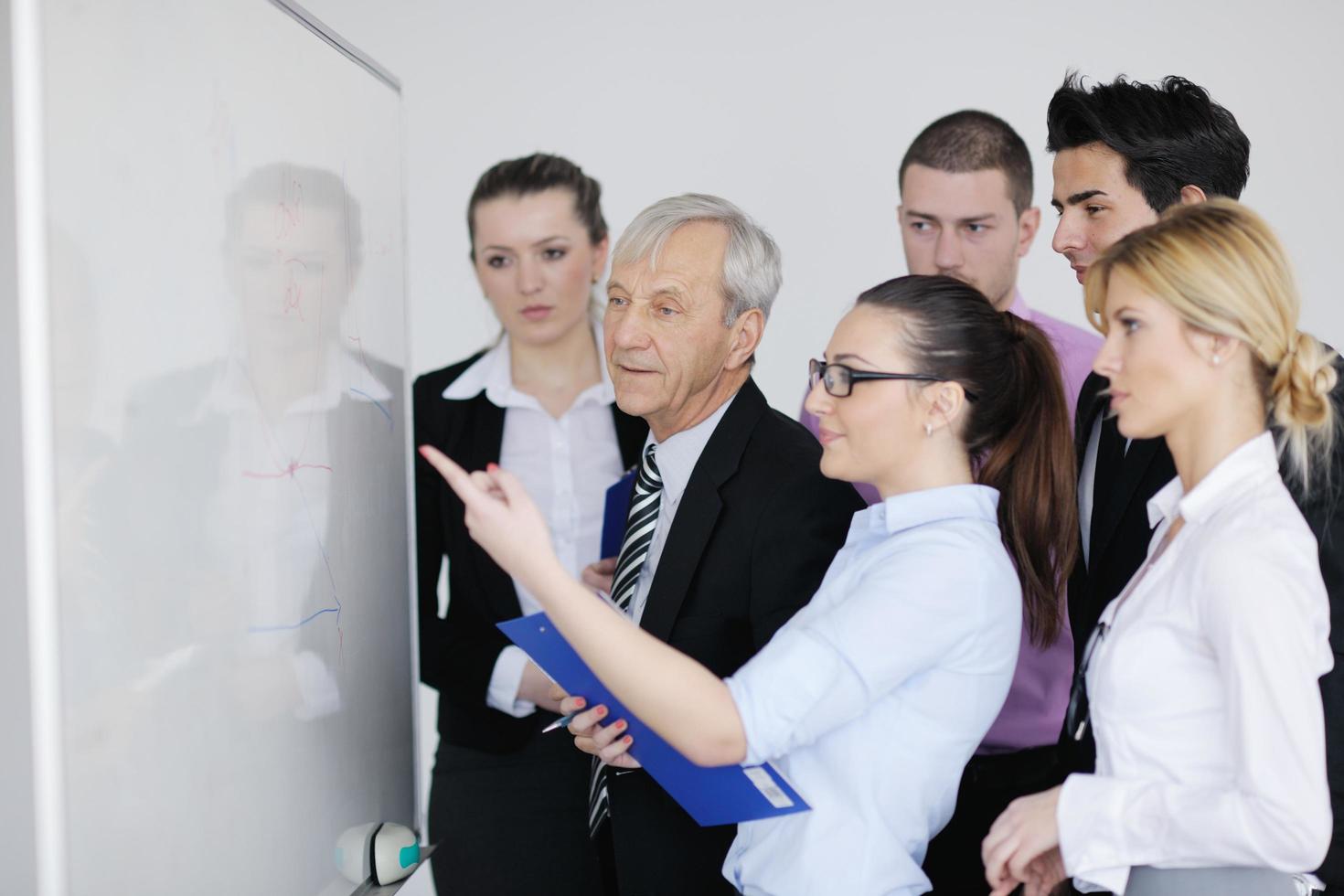 Senior business man giving a presentation photo