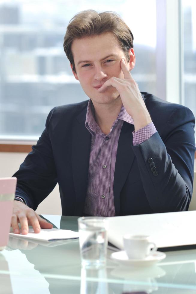 young business man alone in conference room photo