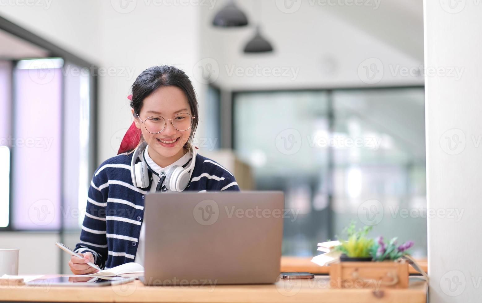 Asian girl student online learning class study online video call zoom teacher, Happy asian girl learn english language online with computer laptop. photo