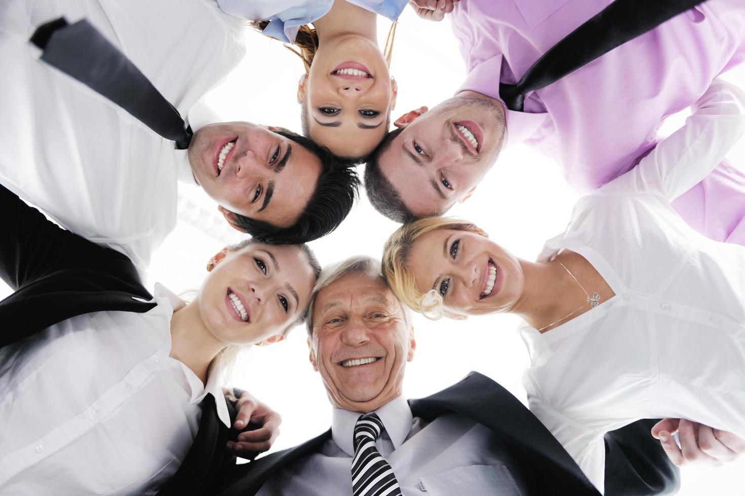 business people with their heads together photo