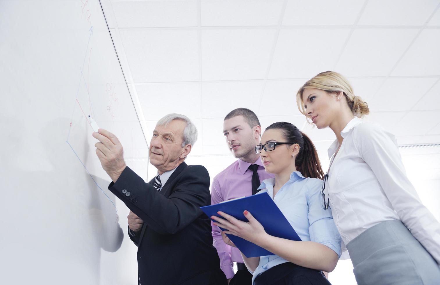 Senior business man giving a presentation photo