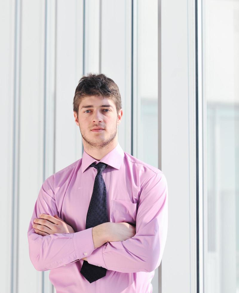 young business man alone in conference room photo