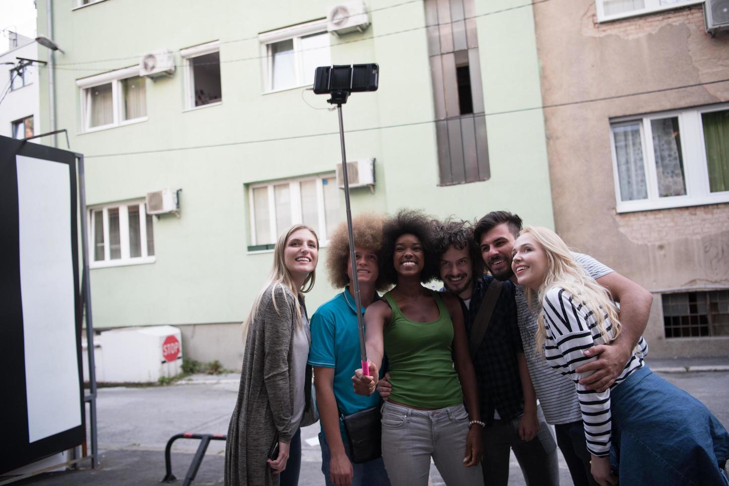 Group of friends taking picture of themselves photo