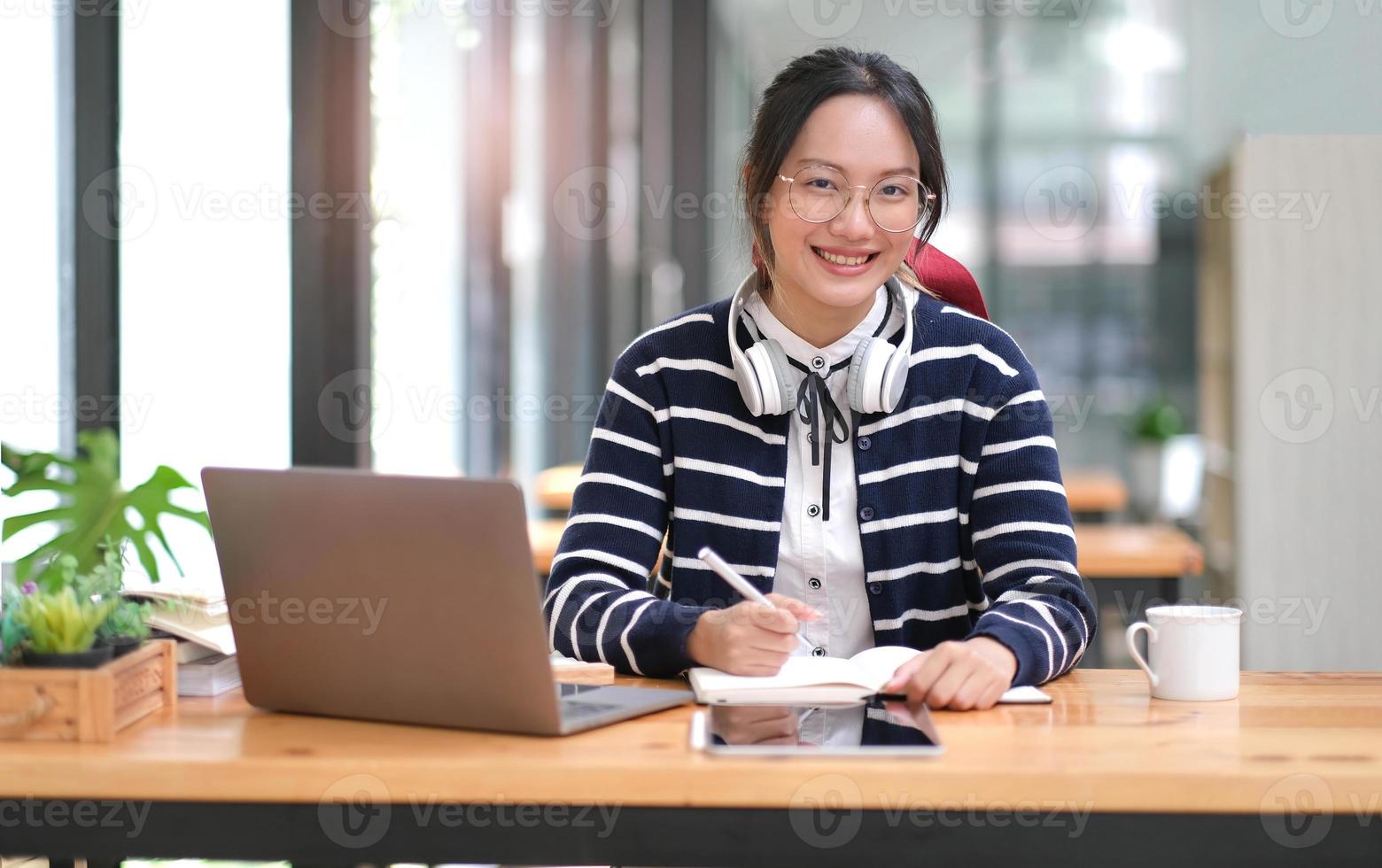 Asian girl student online learning class study online video call zoom teacher, Happy asian girl learn english language online with computer laptop. photo