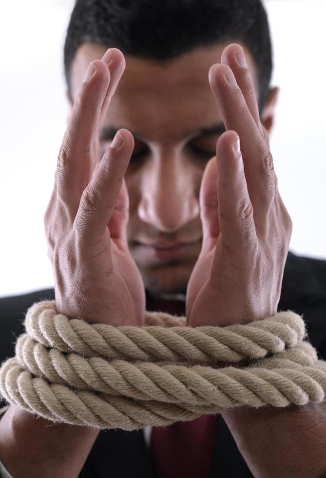 business man with rope isolated on white background photo