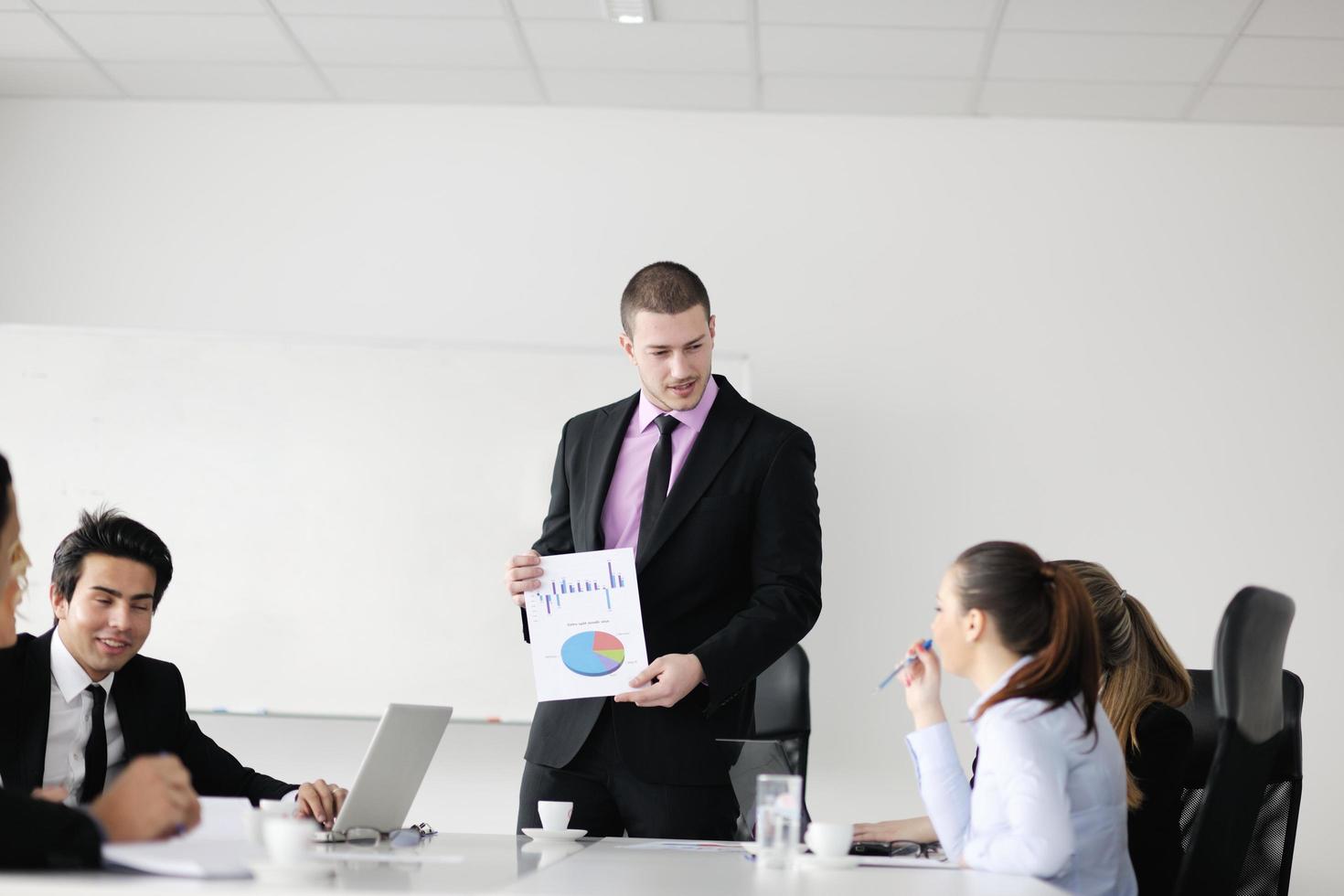 Group of young business people at meeting photo