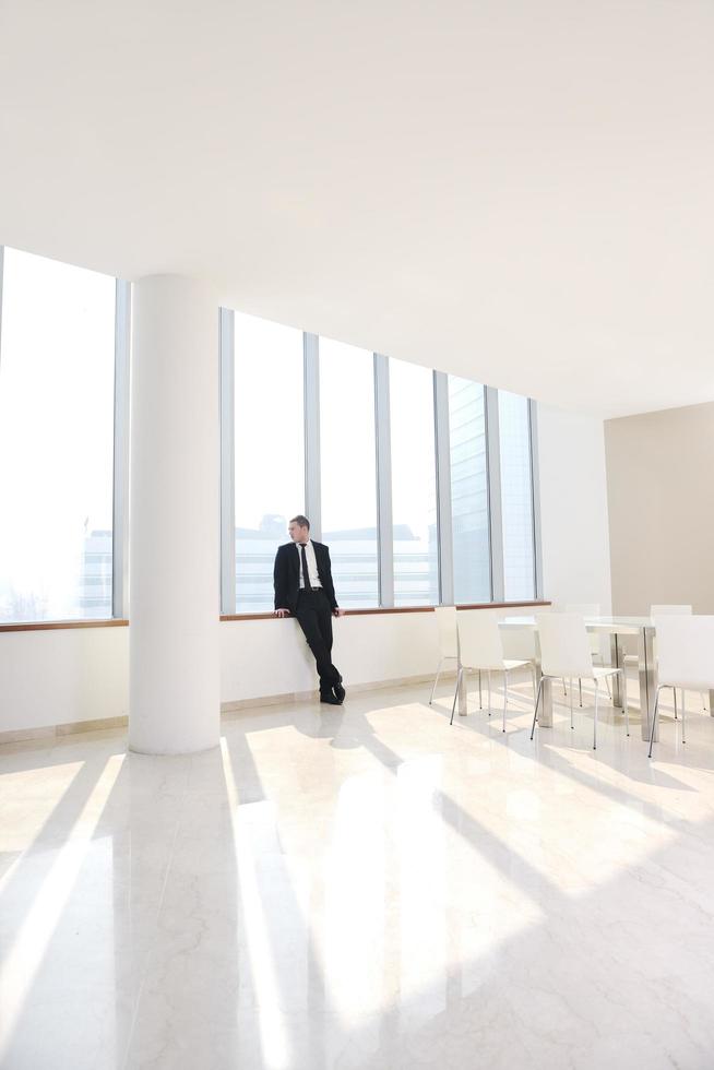 young business man alone in conference room photo