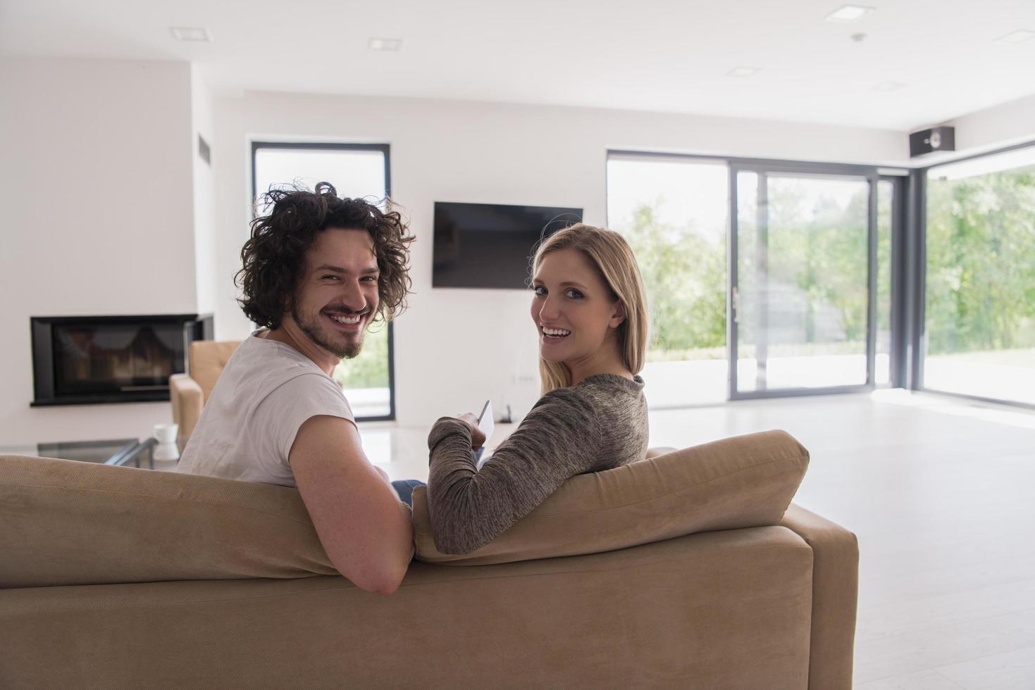 Rear view of couple watching television photo