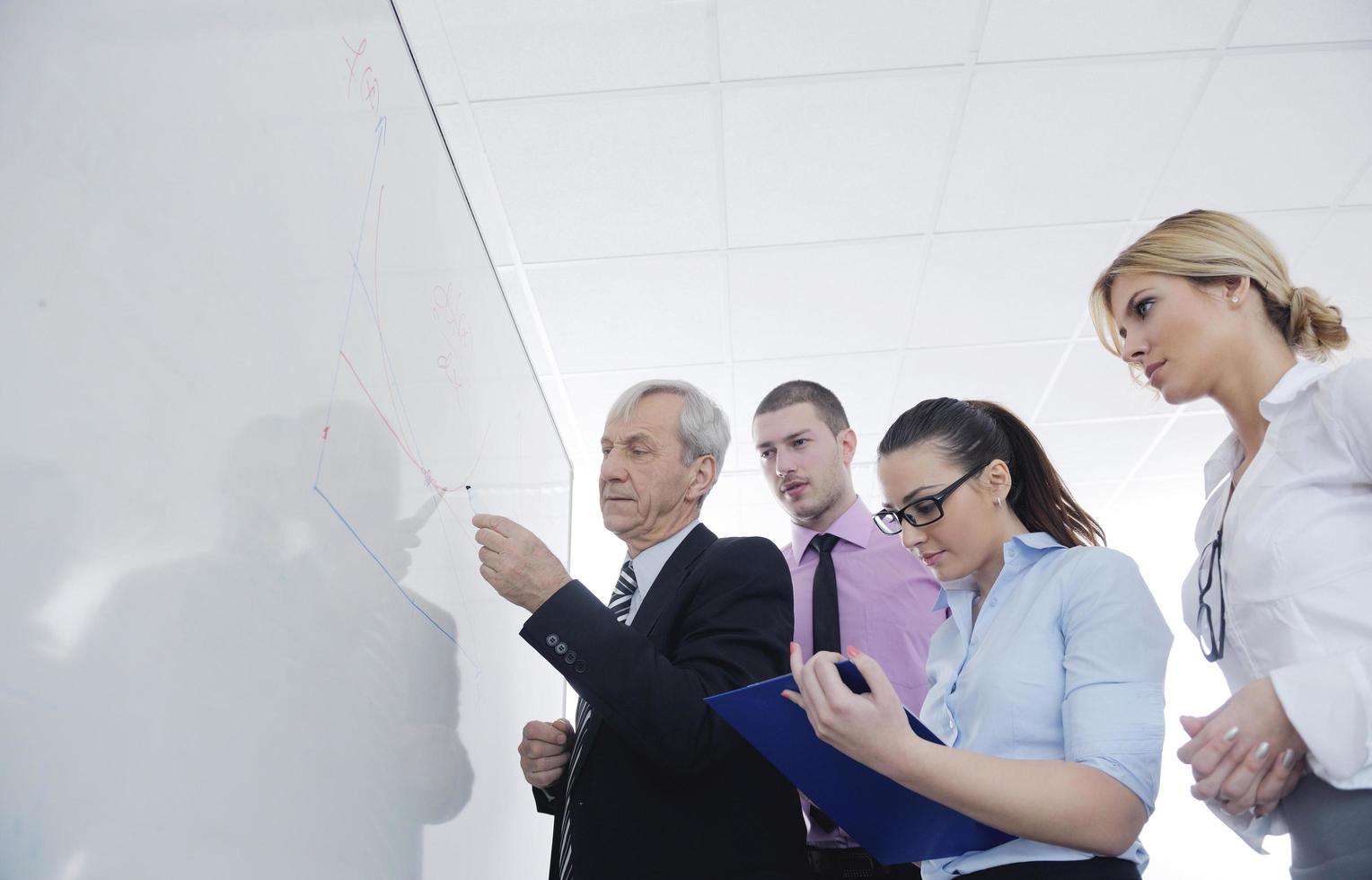 Senior business man giving a presentation photo