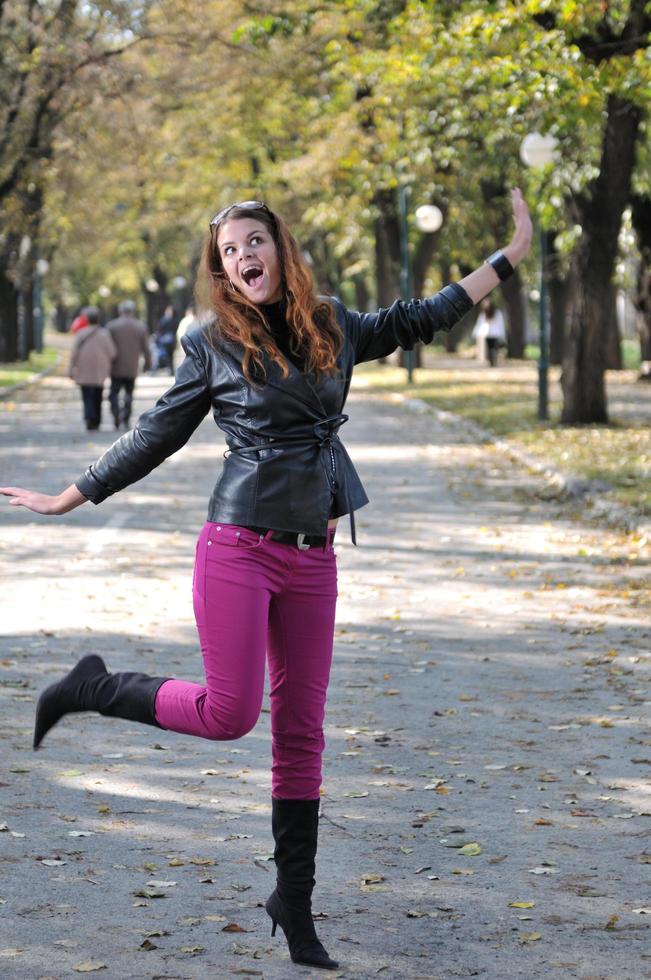 Young woman jumping in nature photo