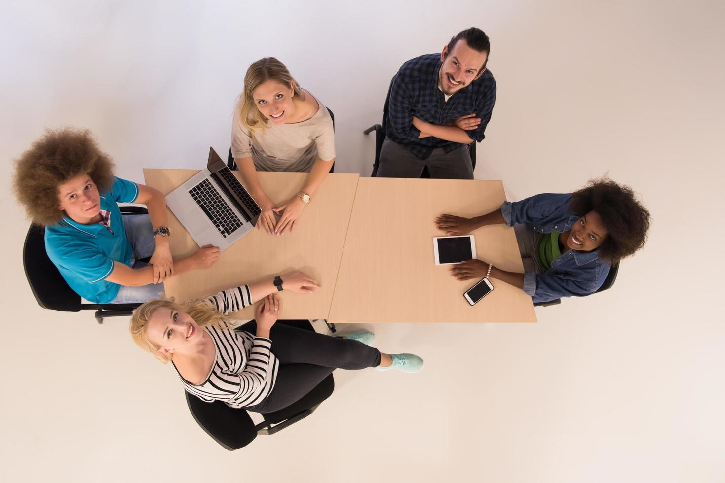 Multiethnic startup business team on meeting  top view photo