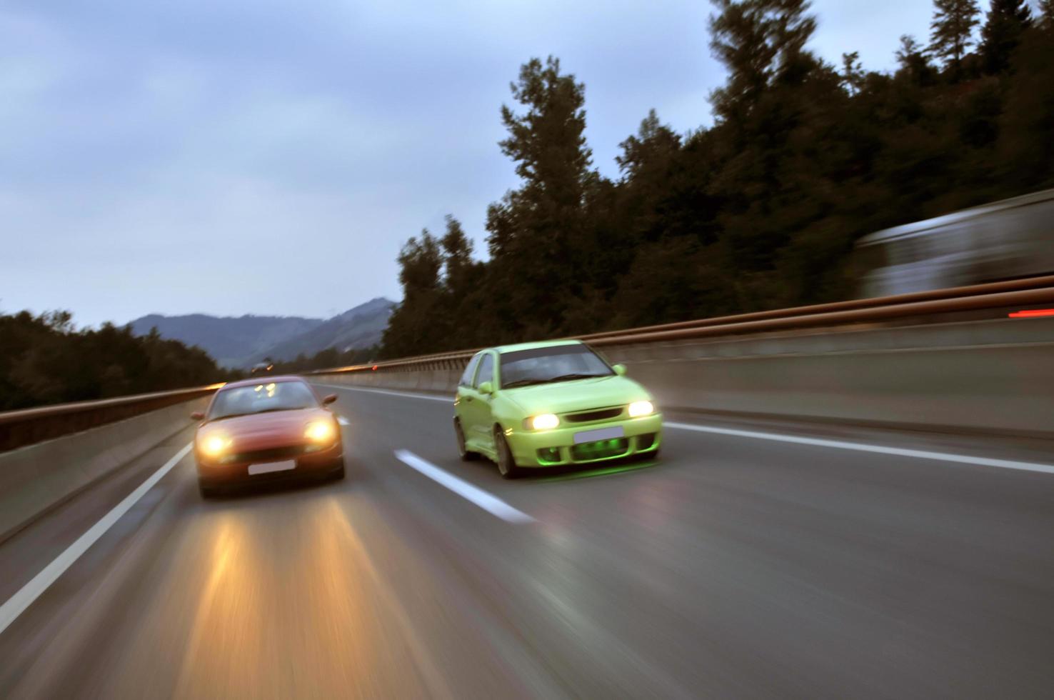 Tuning cars sacing down the highway photo