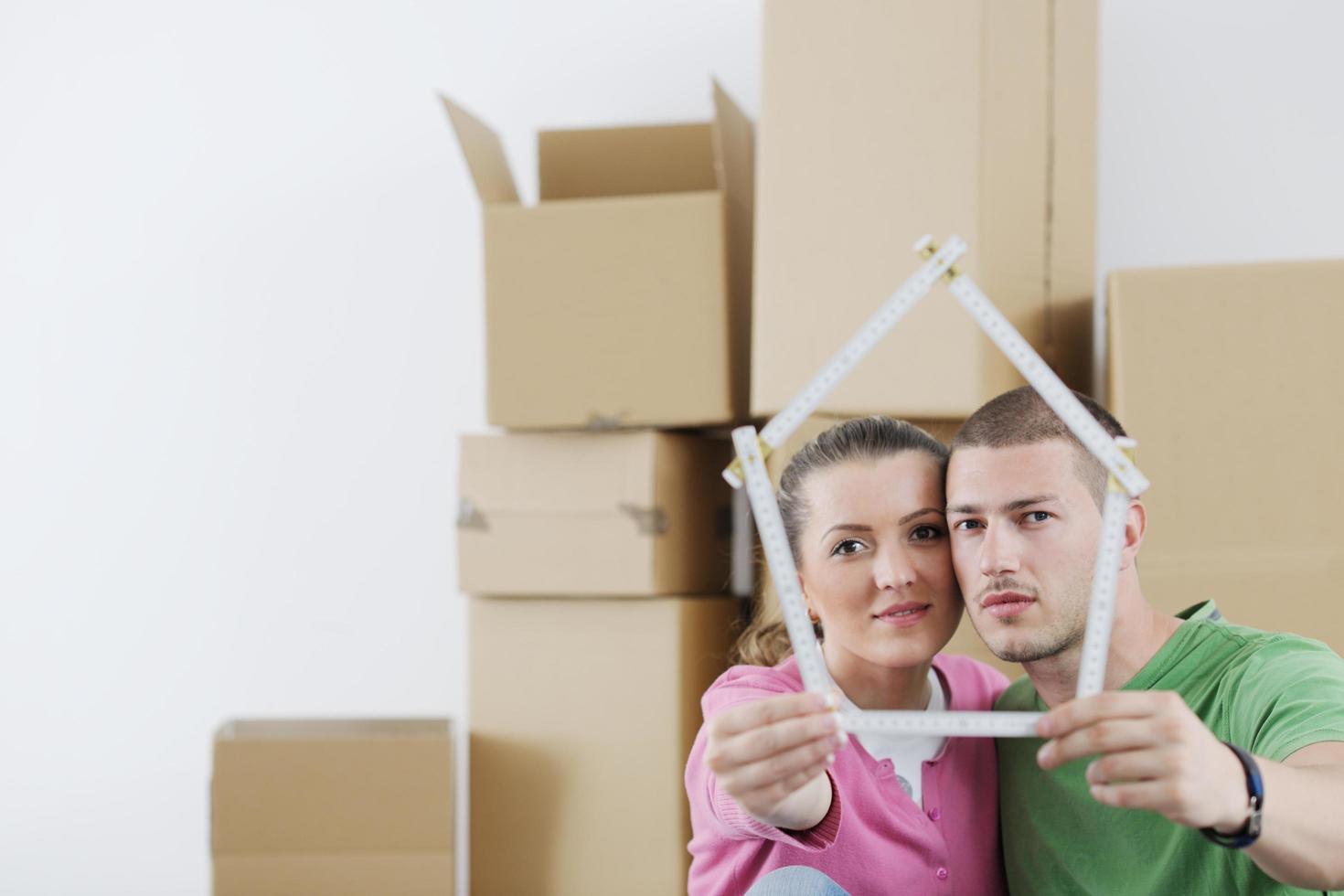 Young couple moving in new house photo