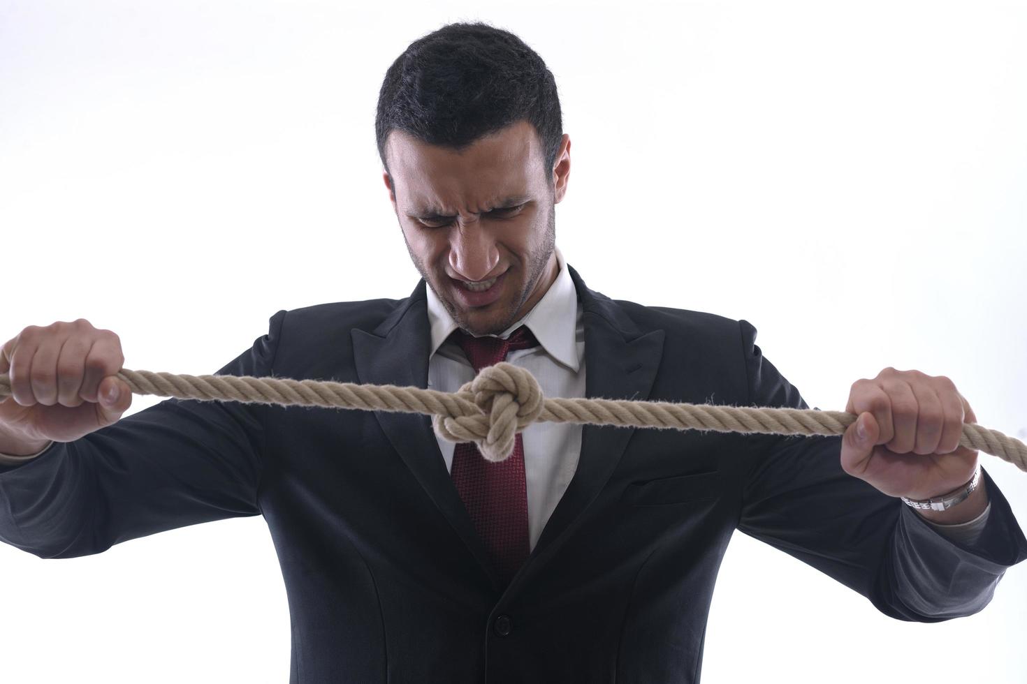 business man with rope isolated on white background photo