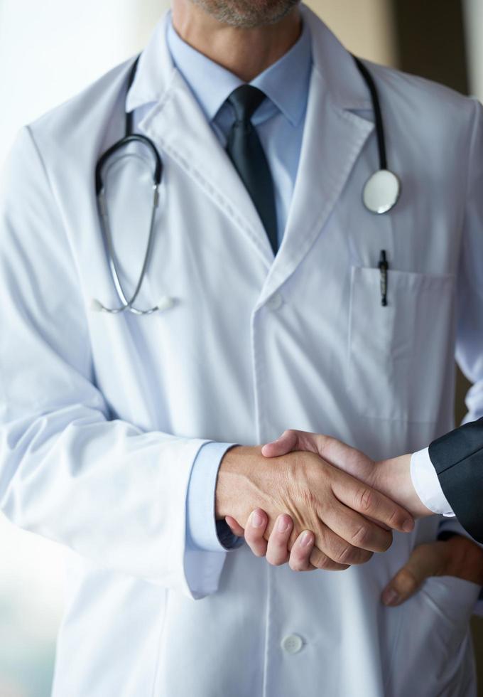 doctor handshake with a patient photo