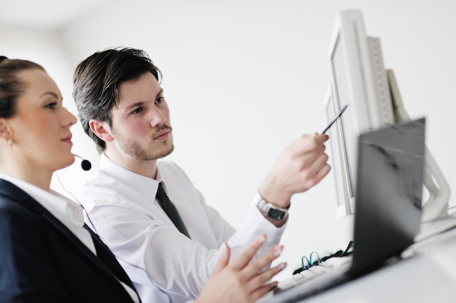 business people group working in customer and help desk office photo