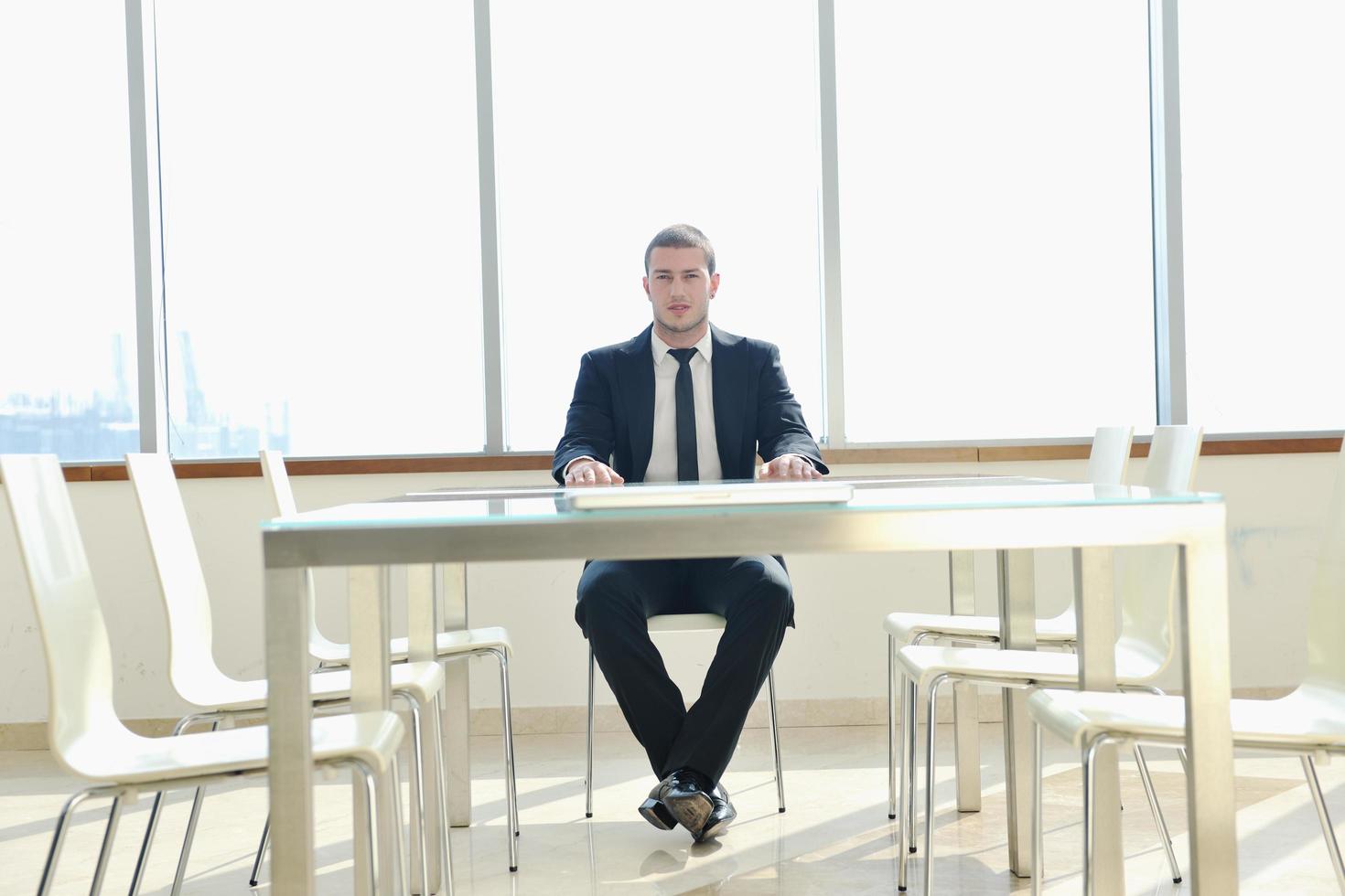 business man alone in conference room photo