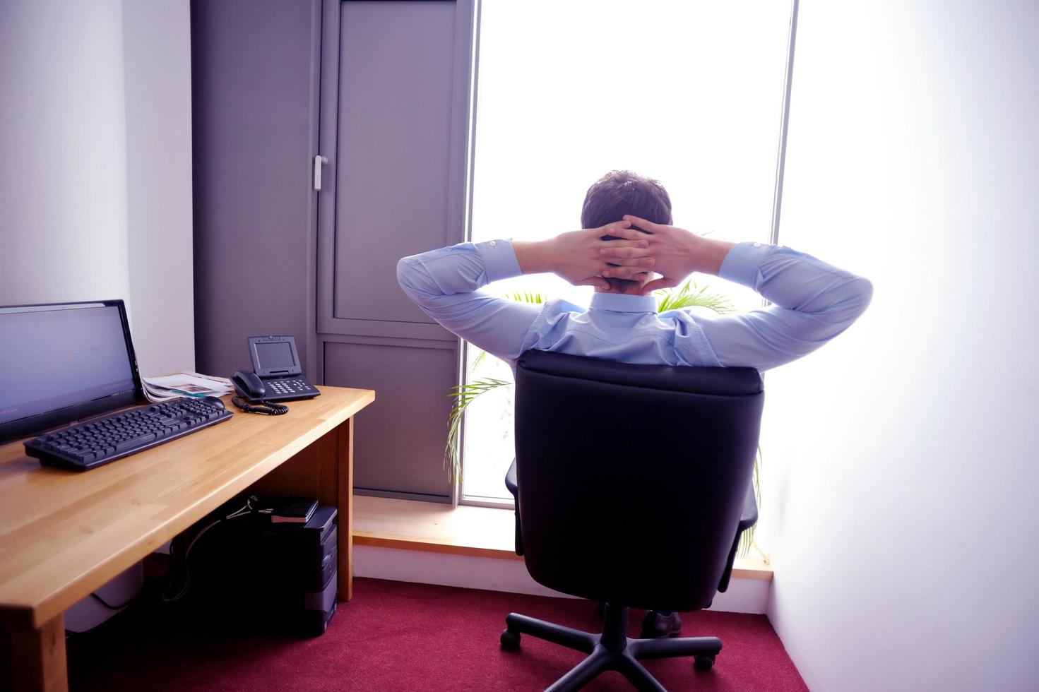 happy young business man at office photo